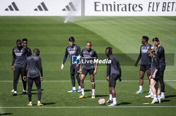 2024-05-07 - MADRID, SPAIN - MAY 7: Real Madrid players (from L to R) Antonio Rudiger, Vinicius Junior, Eder Militao, Eduardo Camavinga, Aurelien Tchouameni warms up during Real Madrid Training Session and Press Conference ahead of their UEFA Champions League semi-final second leg match against FC Bayern Munchen at Ciudad Real Madrid on May 7, 2024 in Valdebebas, Spain. - REAL MADRID VS BAYERN MUNICH: REAL MADRID PRESS CONFERENCE AND TRAINING SESSION - UEFA CHAMPIONS LEAGUE - SOCCER