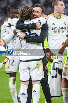 2024-05-08 - MADRID, SPAIN - MAY 8: Davide Ancelotti (R) and Luka Modric (L) of Real Madrid seen celebrating the victory at the end of the UEFA Champions League semi-final second leg match between Real Madrid and FC Bayern Munchen at Estadio Santiago Bernabeu on May 8, 2024 in Madrid, Spain. - REAL MADRID VS BAYERN MUNICH - UEFA CHAMPIONS LEAGUE - SOCCER