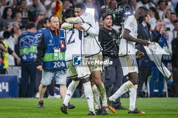 2024-05-08 - MADRID, SPAIN - MAY 8: Jude Bellingham (R) and Eduardo Camavinga (L) of Real Madrid seen celebrating the victory at the end of the UEFA Champions League semi-final second leg match between Real Madrid and FC Bayern Munchen at Estadio Santiago Bernabeu on May 8, 2024 in Madrid, Spain. - REAL MADRID VS BAYERN MUNICH - UEFA CHAMPIONS LEAGUE - SOCCER