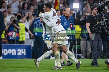 2024-05-08 - MADRID, SPAIN - MAY 8: Jude Bellingham (R) and Eduardo Camavinga (L) of Real Madrid seen celebrating the victory at the end of the UEFA Champions League semi-final second leg match between Real Madrid and FC Bayern Munchen at Estadio Santiago Bernabeu on May 8, 2024 in Madrid, Spain. - REAL MADRID VS BAYERN MUNICH - UEFA CHAMPIONS LEAGUE - SOCCER