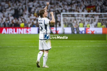 2024-05-08 - MADRID, SPAIN - MAY 8: Luka Modric of Real Madrid seen celebrating the victory at the end of the UEFA Champions League semi-final second leg match between Real Madrid and FC Bayern Munchen at Estadio Santiago Bernabeu on May 8, 2024 in Madrid, Spain. - REAL MADRID VS BAYERN MUNICH - UEFA CHAMPIONS LEAGUE - SOCCER