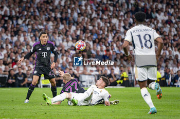 2024-05-08 - MADRID, SPAIN - MAY 8: Federico Valverde of Real Madrid (R) seen in action against Konrad Laimer of FC Bayern Munchen (L) during the UEFA Champions League semi-final second leg match between Real Madrid and FC Bayern Munchen at Estadio Santiago Bernabeu on May 8, 2024 in Madrid, Spain. - REAL MADRID VS BAYERN MUNICH - UEFA CHAMPIONS LEAGUE - SOCCER
