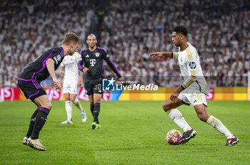 2024-05-08 - MADRID, SPAIN - MAY 8: Jude Bellingham of Real Madrid seen in action with the ball during the UEFA Champions League semi-final second leg match between Real Madrid and FC Bayern Munchen at Estadio Santiago Bernabeu on May 8, 2024 in Madrid, Spain. - REAL MADRID VS BAYERN MUNICH - UEFA CHAMPIONS LEAGUE - SOCCER