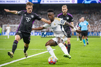 2024-05-08 - MADRID, SPAIN - MAY 8: Vinicius Junior of Real Madrid (R) seen in action against Joshua Kimmich of FC Bayern Munchen (L) during the UEFA Champions League semi-final second leg match between Real Madrid and FC Bayern Munchen at Estadio Santiago Bernabeu on May 8, 2024 in Madrid, Spain. - REAL MADRID VS BAYERN MUNICH - UEFA CHAMPIONS LEAGUE - SOCCER
