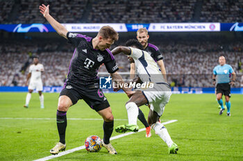 08/05/2024 - MADRID, SPAIN - MAY 8: Vinicius Junior of Real Madrid (R) seen in action against Joshua Kimmich of FC Bayern Munchen (L) during the UEFA Champions League semi-final second leg match between Real Madrid and FC Bayern Munchen at Estadio Santiago Bernabeu on May 8, 2024 in Madrid, Spain. - REAL MADRID VS BAYERN MUNICH - UEFA CHAMPIONS LEAGUE - CALCIO