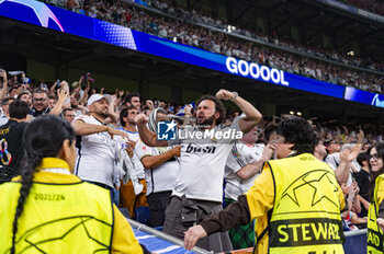 2024-05-08 - MADRID, SPAIN - MAY 8: Real Madrid fans seen celebrating a goal during the UEFA Champions League semi-final second leg match between Real Madrid and FC Bayern Munchen at Estadio Santiago Bernabeu on May 8, 2024 in Madrid, Spain. - REAL MADRID VS BAYERN MUNICH - UEFA CHAMPIONS LEAGUE - SOCCER