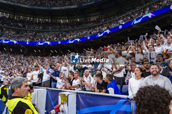 2024-05-08 - MADRID, SPAIN - MAY 8: Real Madrid fans seen celebrating a goal during the UEFA Champions League semi-final second leg match between Real Madrid and FC Bayern Munchen at Estadio Santiago Bernabeu on May 8, 2024 in Madrid, Spain. - REAL MADRID VS BAYERN MUNICH - UEFA CHAMPIONS LEAGUE - SOCCER