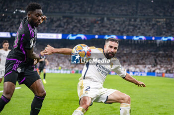 08/05/2024 - MADRID, SPAIN - MAY 8: Daniel Carvajal of Real Madrid (R) seen in action with the ball against Alphonso Davies of FC Bayern Munchen (L) during the UEFA Champions League semi-final second leg match between Real Madrid and FC Bayern Munchen at Estadio Santiago Bernabeu on May 8, 2024 in Madrid, Spain. - REAL MADRID VS BAYERN MUNICH - UEFA CHAMPIONS LEAGUE - CALCIO