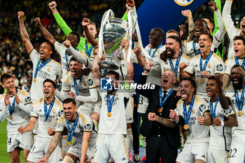 2024-06-01 - Nacho Fernandez of Real Madrid with Champions League trophy and Real Madrid team - FINAL - BORUSSIA DORTMUND VS REAL MADRID - UEFA CHAMPIONS LEAGUE - SOCCER