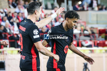 2024-09-19 - Lamine YAMAL of Barcelona celebrate his goal with Robert LEWANDOWSKI of Barcelona during the UEFA Champions League, League Phase MD1 football match between AS Monaco and FC Barcelona on September 19, 2024 at Louis II stadium in Monaco, Monaco - FOOTBALL - CHAMPIONS LEAGUE - MONACO V FC BARCELONA - UEFA CHAMPIONS LEAGUE - SOCCER