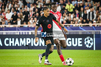 2024-09-19 - Raphael DIAS BELLOLI (Raphinha) of Barcelona and Wilfried SINGO of Monaco during the UEFA Champions League, League Phase MD1 football match between AS Monaco and FC Barcelona on September 19, 2024 at Louis II stadium in Monaco, Monaco - FOOTBALL - CHAMPIONS LEAGUE - MONACO V FC BARCELONA - UEFA CHAMPIONS LEAGUE - SOCCER