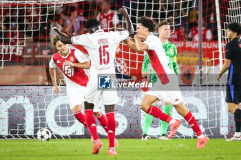 2024-09-19 - Maghnes AKLIOUCHE of Monaco celebrate his goal with Eliesse BEN SEGHIR of Monaco and Lamine CAMARA of Monaco during the UEFA Champions League, League Phase MD1 football match between AS Monaco and FC Barcelona on September 19, 2024 at Louis II stadium in Monaco, Monaco - FOOTBALL - CHAMPIONS LEAGUE - MONACO V FC BARCELONA - UEFA CHAMPIONS LEAGUE - SOCCER