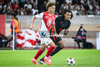 2024-09-19 - Eliesse BEN SEGHIR of Monaco and Jules KOUNDE of Barcelona during the UEFA Champions League, League Phase MD1 football match between AS Monaco and FC Barcelona on September 19, 2024 at Louis II stadium in Monaco, Monaco - FOOTBALL - CHAMPIONS LEAGUE - MONACO V FC BARCELONA - UEFA CHAMPIONS LEAGUE - SOCCER