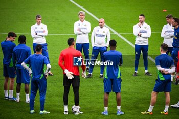 2024-10-21 - Stijn SCHAARS of PSV Eindhoven, Rob MAAS of PSV Eindhoven, Theo LUCIUS of PSV Eindhoven, Terry PETERS of PSV Eindhoven and Peter BOSZ of PSV Eindhoven with teammates during the training session of the PSV Eindhoven ahead of the UEFA Champions League football match between Paris Saint-Germain and PSV Eindhoven on October 21, 2024 at Parc des Princes stadium in Paris, France - FOOTBALL - PSV TRAINING AND PRESS CONFERENCE - UEFA CHAMPIONS LEAGUE - SOCCER