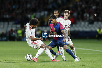 2024-10-23 - Lamine Yamal of FC Barcelona and Serge Gnabry, Joshua Kimmich of Bayern Munich during the UEFA Champions League, League phase, Matchday 3 football match between FC Barcelona and Bayern Munich on 23 October 2024 at Estadi Olímpic Lluís Companys in Barcelona, Spain - FOOTBALL - CHAMPIONS LEAGUE - FC BARCELONA V BAYERN MUNICH - UEFA CHAMPIONS LEAGUE - SOCCER