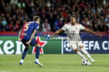 2024-10-23 - Inigo Martinez of FC Barcelona and Michael Olise of Bayern Munich during the UEFA Champions League, League phase, Matchday 3 football match between FC Barcelona and Bayern Munich on 23 October 2024 at Estadi Olímpic Lluís Companys in Barcelona, Spain - FOOTBALL - CHAMPIONS LEAGUE - FC BARCELONA V BAYERN MUNICH - UEFA CHAMPIONS LEAGUE - SOCCER