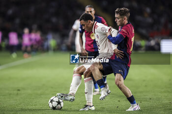 2024-10-23 - Jamal Musiala of Bayern Munich and Marc Casado of FC Barcelona during the UEFA Champions League, League phase, Matchday 3 football match between FC Barcelona and Bayern Munich on 23 October 2024 at Estadi Olímpic Lluís Companys in Barcelona, Spain - FOOTBALL - CHAMPIONS LEAGUE - FC BARCELONA V BAYERN MUNICH - UEFA CHAMPIONS LEAGUE - SOCCER