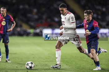 2024-10-23 - Jamal Musiala of Bayern Munich and Marc Casado of FC Barcelona during the UEFA Champions League, League phase, Matchday 3 football match between FC Barcelona and Bayern Munich on 23 October 2024 at Estadi Olímpic Lluís Companys in Barcelona, Spain - FOOTBALL - CHAMPIONS LEAGUE - FC BARCELONA V BAYERN MUNICH - UEFA CHAMPIONS LEAGUE - SOCCER