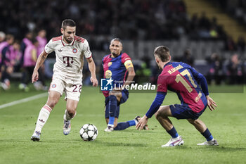 2024-10-23 - Raphael Guerreiro of Bayern Munich and Marc Casado of FC Barcelona during the UEFA Champions League, League phase, Matchday 3 football match between FC Barcelona and Bayern Munich on 23 October 2024 at Estadi Olímpic Lluís Companys in Barcelona, Spain - FOOTBALL - CHAMPIONS LEAGUE - FC BARCELONA V BAYERN MUNICH - UEFA CHAMPIONS LEAGUE - SOCCER