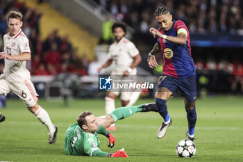 2024-10-23 - Raphinha of FC Barcelona and Manuel Neuer of Bayern Munich during the UEFA Champions League, League phase, Matchday 3 football match between FC Barcelona and Bayern Munich on 23 October 2024 at Estadi Olímpic Lluís Companys in Barcelona, Spain - FOOTBALL - CHAMPIONS LEAGUE - FC BARCELONA V BAYERN MUNICH - UEFA CHAMPIONS LEAGUE - SOCCER