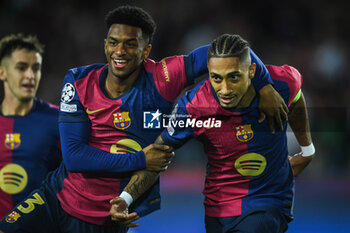 2024-10-23 - Raphael DIAS BELLOLI (Raphinha) of Barcelona celebrate his goal with Alejandro BALDE of Barcelona during the UEFA Champions League, League Phase MD3 football match between FC Barcelona and Bayern Munich on 23 October 2024 at Estadi Olimpic Lluis Companys in Barcelona, Spain - FOOTBALL - CHAMPIONS LEAGUE - FC BARCELONA V BAYERN MUNICH - UEFA CHAMPIONS LEAGUE - SOCCER