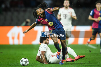 2024-10-23 - Serge GNABRY of Bayern Munich and Jules KOUNDE of Barcelona during the UEFA Champions League, League Phase MD3 football match between FC Barcelona and Bayern Munich on 23 October 2024 at Estadi Olimpic Lluis Companys in Barcelona, Spain - FOOTBALL - CHAMPIONS LEAGUE - FC BARCELONA V BAYERN MUNICH - UEFA CHAMPIONS LEAGUE - SOCCER