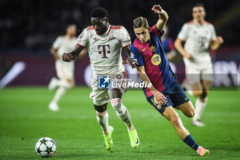 2024-10-23 - Alphonso DAVIES of Bayern Munich and Fermin LOPEZ of Barcelona during the UEFA Champions League, League Phase MD3 football match between FC Barcelona and Bayern Munich on 23 October 2024 at Estadi Olimpic Lluis Companys in Barcelona, Spain - FOOTBALL - CHAMPIONS LEAGUE - FC BARCELONA V BAYERN MUNICH - UEFA CHAMPIONS LEAGUE - SOCCER