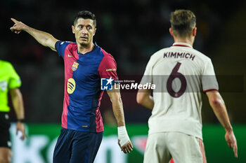 2024-10-23 - Robert LEWANDOWSKI of Barcelona and Joshua KIMMICH of Bayern Munich during the UEFA Champions League, League Phase MD3 football match between FC Barcelona and Bayern Munich on 23 October 2024 at Estadi Olimpic Lluis Companys in Barcelona, Spain - FOOTBALL - CHAMPIONS LEAGUE - FC BARCELONA V BAYERN MUNICH - UEFA CHAMPIONS LEAGUE - SOCCER