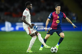 2024-10-23 - Alphonso DAVIES of Bayern Munich and Robert LEWANDOWSKI of Barcelona during the UEFA Champions League, League Phase MD3 football match between FC Barcelona and Bayern Munich on 23 October 2024 at Estadi Olimpic Lluis Companys in Barcelona, Spain - FOOTBALL - CHAMPIONS LEAGUE - FC BARCELONA V BAYERN MUNICH - UEFA CHAMPIONS LEAGUE - SOCCER