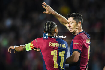 2024-10-23 - Robert LEWANDOWSKI of Barcelona celebrate his goal with Raphael DIAS BELLOLI (Raphinha) of Barcelona during the UEFA Champions League, League Phase MD3 football match between FC Barcelona and Bayern Munich on 23 October 2024 at Estadi Olimpic Lluis Companys in Barcelona, Spain - FOOTBALL - CHAMPIONS LEAGUE - FC BARCELONA V BAYERN MUNICH - UEFA CHAMPIONS LEAGUE - SOCCER