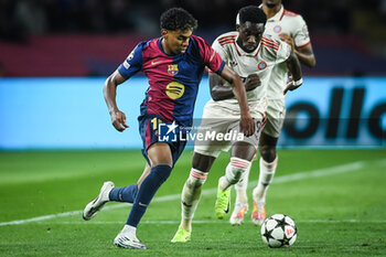 2024-10-23 - Lamine YAMAL of Barcelona and Alphonso DAVIES of Bayern Munich during the UEFA Champions League, League Phase MD3 football match between FC Barcelona and Bayern Munich on 23 October 2024 at Estadi Olimpic Lluis Companys in Barcelona, Spain - FOOTBALL - CHAMPIONS LEAGUE - FC BARCELONA V BAYERN MUNICH - UEFA CHAMPIONS LEAGUE - SOCCER