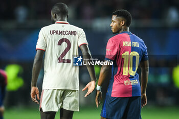 2024-10-23 - Dayot UPAMECANO of Bayern Munich and Ansu FARI of Barcelona during the UEFA Champions League, League Phase MD3 football match between FC Barcelona and Bayern Munich on 23 October 2024 at Estadi Olimpic Lluis Companys in Barcelona, Spain - FOOTBALL - CHAMPIONS LEAGUE - FC BARCELONA V BAYERN MUNICH - UEFA CHAMPIONS LEAGUE - SOCCER