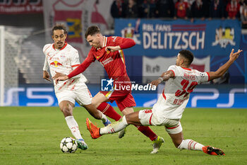 2024-10-23 - RB Leipzig defender Benjamin Henrichs (39) tackles Liverpool defender Andrew Robertson (26) during the UEFA Champions League, League phase, Matchday 3 football match between RB Leipzig and Liverpool FC on 23 October 2024 at Red Bull Arena in Leipzig, Germany - FOOTBALL - CHAMPIONS LEAGUE - LEIPZIG V LIVERPOOL - UEFA CHAMPIONS LEAGUE - SOCCER