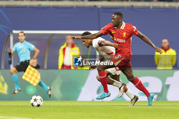 2024-10-23 - Liverpool defender Ibrahima Konaté (5) battles with RB Leipzig forward Loïs Openda (11) during the UEFA Champions League, League phase, Matchday 3 football match between RB Leipzig and Liverpool FC on 23 October 2024 at Red Bull Arena in Leipzig, Germany - FOOTBALL - CHAMPIONS LEAGUE - LEIPZIG V LIVERPOOL - UEFA CHAMPIONS LEAGUE - SOCCER