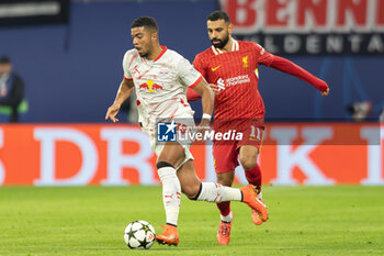 2024-10-23 - Liverpool forward Mohamed Salah (11) battles with RB Leipzig defender Benjamin Henrichs (39) during the UEFA Champions League, League phase, Matchday 3 football match between RB Leipzig and Liverpool FC on 23 October 2024 at Red Bull Arena in Leipzig, Germany - FOOTBALL - CHAMPIONS LEAGUE - LEIPZIG V LIVERPOOL - UEFA CHAMPIONS LEAGUE - SOCCER