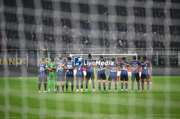 2024-11-06 - Lineup of Inter FC done minute of silence during the UEFA Champions League stage match Phase MD4 between Inter FC Internazionale and Arsenal FC, on 6 of November 2024, at Giuseppe Meazza San Siro Siro stadium in Milan, Italy - INTER - FC INTERNAZIONALE VS ARSENAL FC - UEFA CHAMPIONS LEAGUE - SOCCER