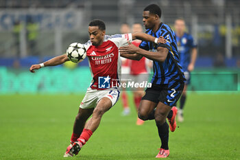 2024-11-06 - JURRIEN TIMBER of Arsenal FC and Denzel Dumfries of Fc Inter during the UEFA Champions League stage match Phase MD4 between Inter FC Internazionale and Arsenal FC, on 6 of November 2024, at Giuseppe Meazza San Siro Siro stadium in Milan, Italy - INTER - FC INTERNAZIONALE VS ARSENAL FC - UEFA CHAMPIONS LEAGUE - SOCCER