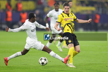 2024-11-05 - Malick Yalcouye of Sturm Graz and Marcel Sabitzer of Borussia Dortmund during the UEFA Champions League, League phase, Matchday 4 football match between Borussia Dortmund and Sturm Graz on 5 November 2024 at Signal Iduna Park in Dortmund, Germany - FOOTBALL - CHAMPIONS LEAGUE - BORUSSIA DORTMUND V STURM GRAZ - UEFA CHAMPIONS LEAGUE - SOCCER