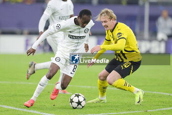 2024-11-05 - Malick Yalcouye of Sturm Graz and Julian Brandt of Borussia Dortmund during the UEFA Champions League, League phase, Matchday 4 football match between Borussia Dortmund and Sturm Graz on 5 November 2024 at Signal Iduna Park in Dortmund, Germany - FOOTBALL - CHAMPIONS LEAGUE - BORUSSIA DORTMUND V STURM GRAZ - UEFA CHAMPIONS LEAGUE - SOCCER