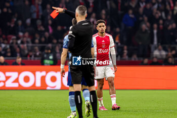 2024-03-07 - Referee Enea Jorgji shows red card to Tristan Gooijer of AFC Ajax during the UEFA Europa Conference League, Round of 16, 1st leg football match between AFC Ajax and Aston Villa FC on March 7, 2024 at Johan Cruijff ArenA in Amsterdam, Netherlands - FOOTBALL - CONFERENCE LEAGUE - AJAX V ASTON VILLA - UEFA CONFERENCE LEAGUE - SOCCER