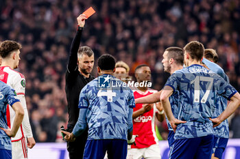 2024-03-07 - Referee Enea Jorgji shows red card to Ezri Konsa of Aston Villa FC during the UEFA Europa Conference League, Round of 16, 1st leg football match between AFC Ajax and Aston Villa FC on March 7, 2024 at Johan Cruijff ArenA in Amsterdam, Netherlands - FOOTBALL - CONFERENCE LEAGUE - AJAX V ASTON VILLA - UEFA CONFERENCE LEAGUE - SOCCER