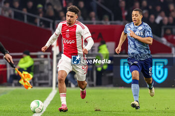 2024-03-07 - Tristan Gooijer of AFC Ajax battles for possession with Youri Tielemans of Aston Villa FC during the UEFA Europa Conference League, Round of 16, 1st leg football match between AFC Ajax and Aston Villa FC on March 7, 2024 at Johan Cruijff ArenA in Amsterdam, Netherlands - FOOTBALL - CONFERENCE LEAGUE - AJAX V ASTON VILLA - UEFA CONFERENCE LEAGUE - SOCCER