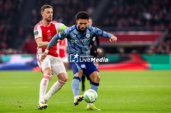 2024-03-07 - Douglas Luiz of Aston Villa FC battles for possession with Jordan Henderson of AFC Ajax during the UEFA Europa Conference League, Round of 16, 1st leg football match between AFC Ajax and Aston Villa FC on March 7, 2024 at Johan Cruijff ArenA in Amsterdam, Netherlands - FOOTBALL - CONFERENCE LEAGUE - AJAX V ASTON VILLA - UEFA CONFERENCE LEAGUE - SOCCER