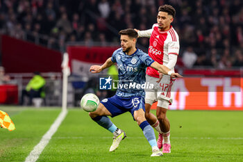2024-03-07 - Alex Moreno of Aston Villa FC battles for possession with Tristan Gooijer of AFC Ajax during the UEFA Europa Conference League, Round of 16, 1st leg football match between AFC Ajax and Aston Villa FC on March 7, 2024 at Johan Cruijff ArenA in Amsterdam, Netherlands - FOOTBALL - CONFERENCE LEAGUE - AJAX V ASTON VILLA - UEFA CONFERENCE LEAGUE - SOCCER
