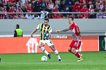 2024-04-11 - 17 Irfan Can Kahveci of Fenerbahce competing with 6 Chiquinho of Olympiacos Piraeus during the UEFA Conference League, Quarter-finals, 1st leg, match between Olympiacos Piraeus and Fenerbahce at Georgios Karaiskakis Stadium on April 11, 2024, in Piraeus, Greece. - OLYMPIACOS VS FENERBAHCE - QUARTER-FINALS, 1ST LEG - UEFA CONFERENCE LEAGUE - SOCCER