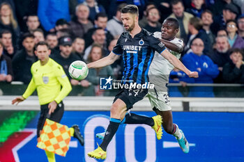 2024-04-11 - Brandon Mechele of Club Brugge battles for the ball with Mbwana Samatta of PAOK during the UEFA Europa Conference League, Quarter-finals, 1st leg football match between Club Brugge KV and PAOK Saloniki on April 11, 2024 at Jan Breydelstadion in Brugge, Belgium - FOOTBALL - CONFERENCE LEAGUE - CLUB BRUGGE V PAOK - UEFA CONFERENCE LEAGUE - SOCCER