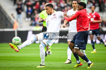 2024-04-18 - Ezri KONSA of Aston Villa and Jonathan DAVID of Lille during the UEFA Conference League, Quarter-finals, 2nd leg football match between Losc Lille and Aston Villa on April 18, 2024 at Pierre Mauroy stadium in Villeneuve-d'Ascq near Lille, France - FOOTBALL - CONFERENCE LEAGUE - LILLE V ASTON VILLA - UEFA CONFERENCE LEAGUE - SOCCER