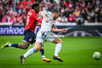 2024-04-18 - Jonathan DAVID of Lille and John MCGINN of Aston Villa during the UEFA Conference League, Quarter-finals, 2nd leg football match between Losc Lille and Aston Villa on April 18, 2024 at Pierre Mauroy stadium in Villeneuve-d'Ascq near Lille, France - FOOTBALL - CONFERENCE LEAGUE - LILLE V ASTON VILLA - UEFA CONFERENCE LEAGUE - SOCCER