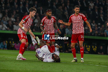 2024-05-29 - Panagiotis Retsos (Olympiacos F.C.) in action against M'Bala Nzola (A.C.F. Fiorentina) during UEFA Europa Conference League 2024 final soccer match between Olympiacos F.C. vs. A.C.F. Fiorentina at OPAP Arena, Athens, 29th of May 2024 - FINAL - OLYMPIACOS VS ACF FIORENTINA - UEFA CONFERENCE LEAGUE - SOCCER