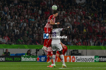 2024-05-29 - Quini (Olympiacos F.C.) in action against M'Bala Nzola (A.C.F. Fiorentina) during UEFA Europa Conference League 2024 final soccer match between Olympiacos F.C. vs. A.C.F. Fiorentina at OPAP Arena, Athens, 29th of May 2024 - FINAL - OLYMPIACOS VS ACF FIORENTINA - UEFA CONFERENCE LEAGUE - SOCCER